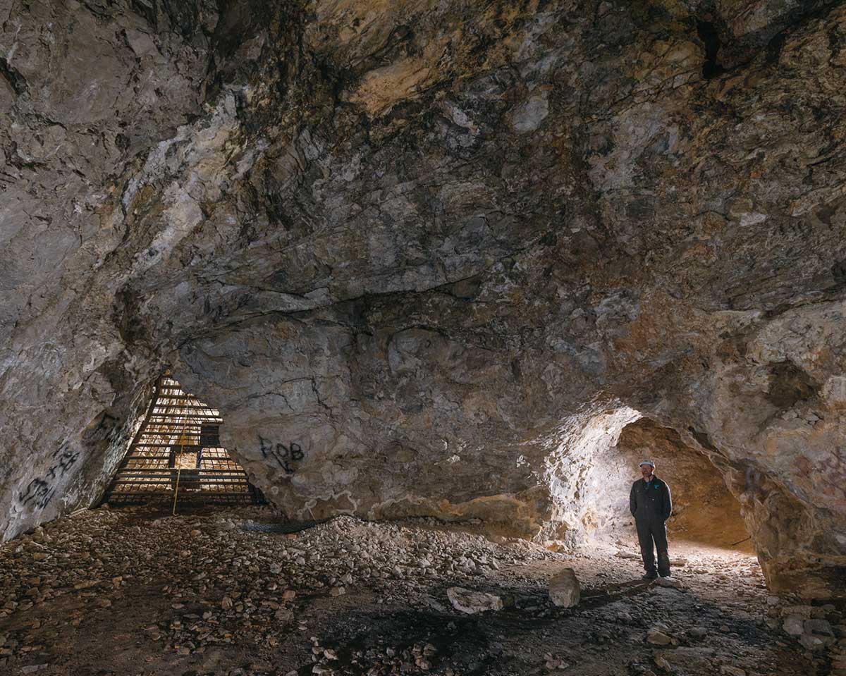 Person standing in a cave