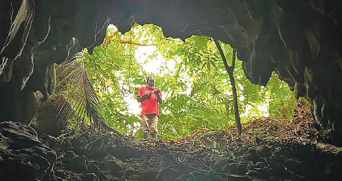 Donald Moore stands near the entrance to Stony Hill Cave, which he sold to conservation groups to protect bats
