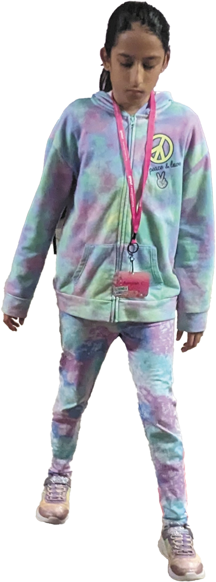 Cut out image of young girl in a pastel tie dye outfit wearing a pink lanyard with a name tag around her neck