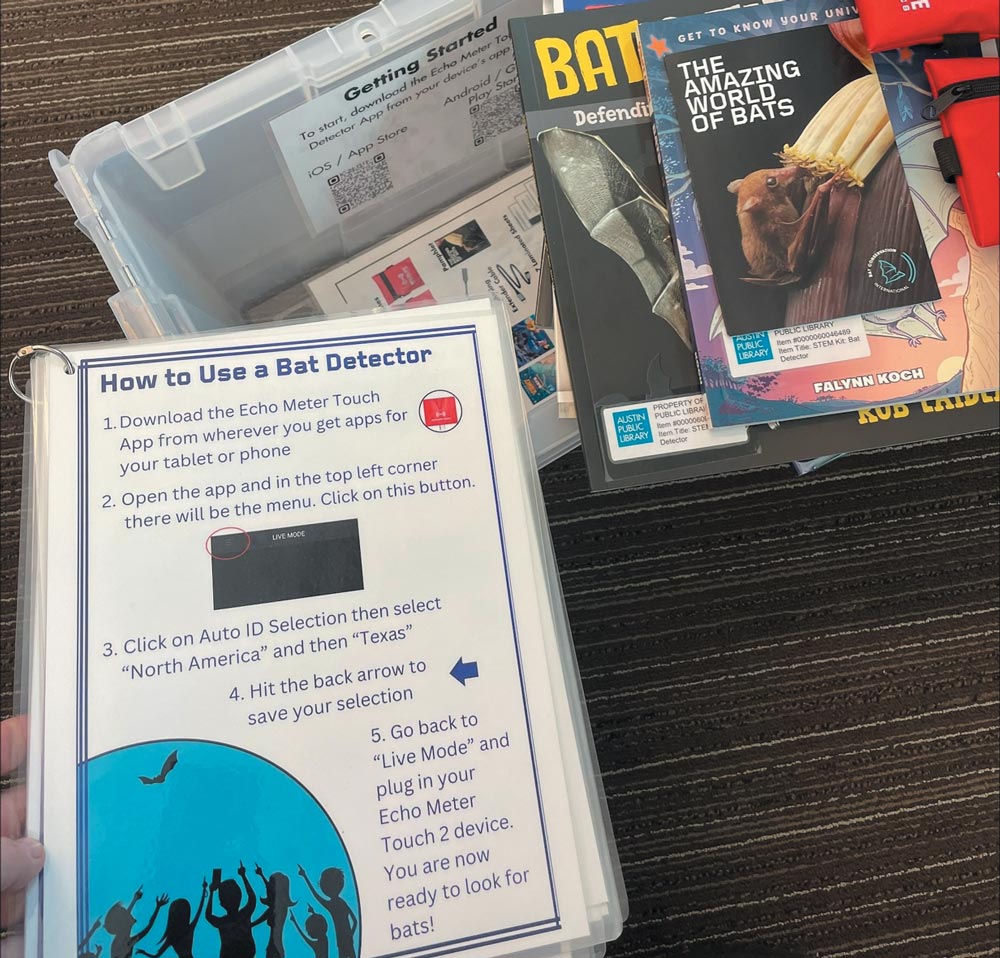 A close-up shows a "How to Use a Bat Detector" instructional guide alongside books like "The Amazing World of Bats" in an educational kit.