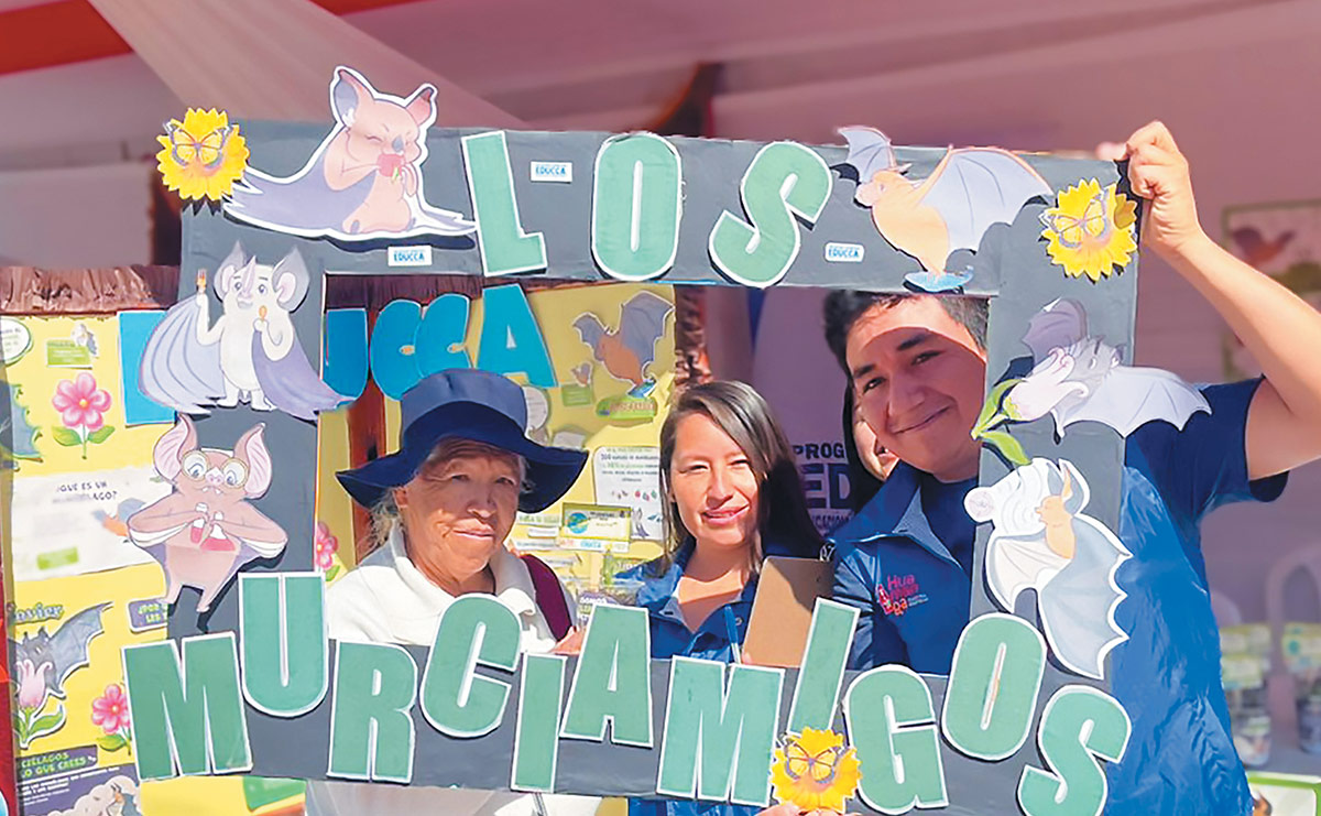 community members from Peru’s Central Andes holding up sign from the Bat Kit of Peru event
